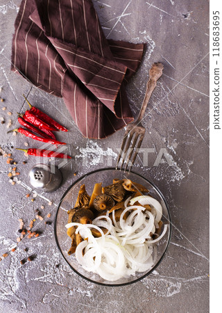Marinated mushrooms in a glass bowl Marinated mushrooms in a glass bowl 118683695
