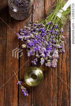 lavender essential oil in glass bottle with fresh lavender flowers, 118683710