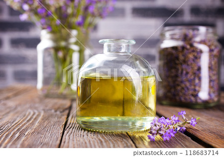 lavender essential oil in glass bottle with fresh lavender flowers, 118683714