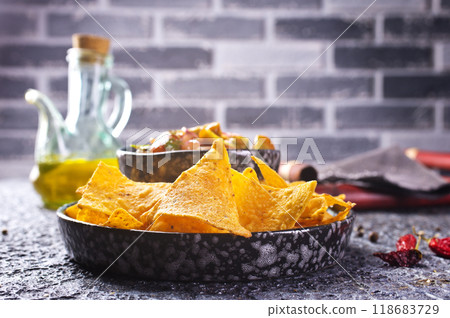 Nachos with guacamole and vegetables. 118683729