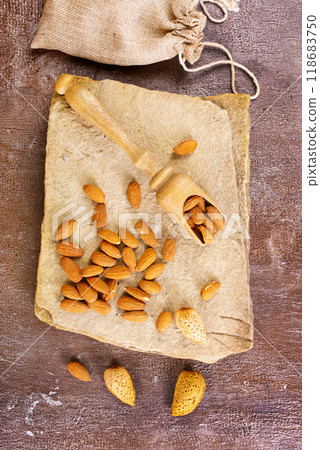 Almond on stone background, dry almond 118683750