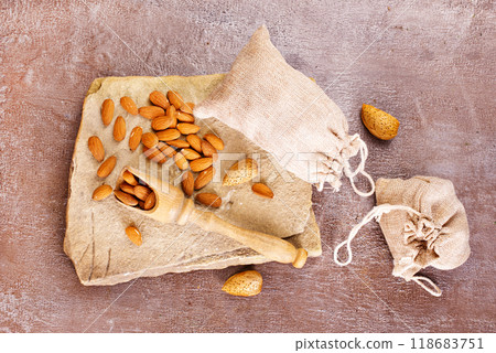 Almond on stone background, dry almond 118683751