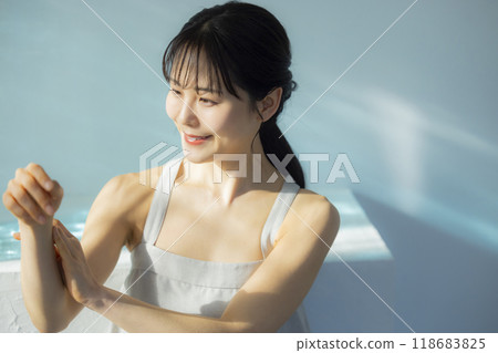 Woman taking care of her body Woman taking care of her body 118683825