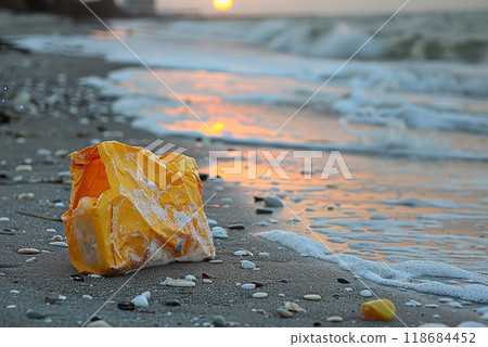 a plastic packaging, in the beach coast, pollution, garbage. 118684452