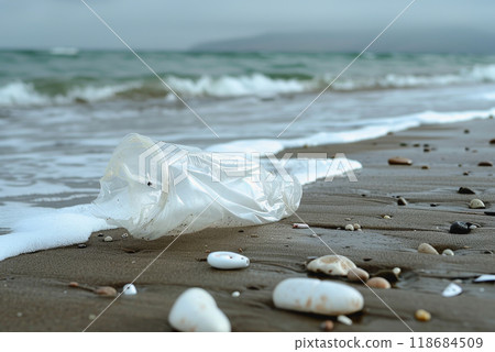 a plastic packaging, in the beach coast, pollution, garbage. 118684509