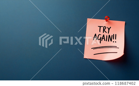 Pink sticky note on blue wall saying try again 118687402
