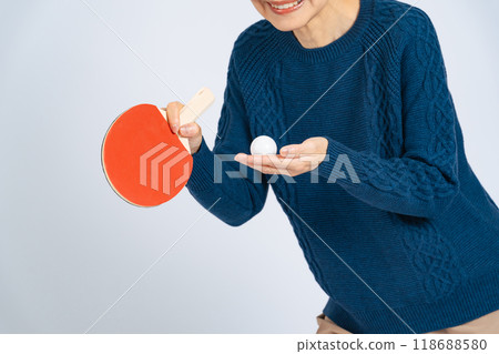 Senior woman with a table tennis racket and ball 118688580