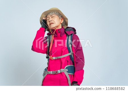 Senior woman in hiking clothes feeling dizzy 118688582