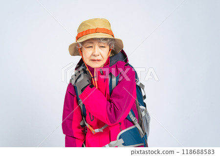 Senior woman in hiking clothes tired from outdoor leisure 118688583