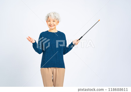 Senior woman with a pointer stick 118688611