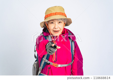 Senior woman in mountaineering clothes to be careful Senior woman in mountaineering clothes to be careful 118688614
