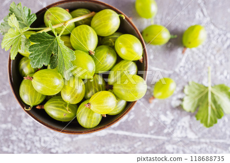 fresh organic gooseberries in a wooden bowl 118688735
