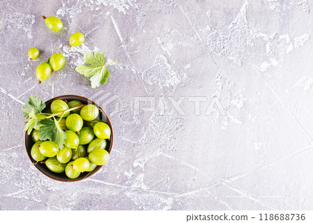 fresh organic gooseberries in a wooden bowl 118688736