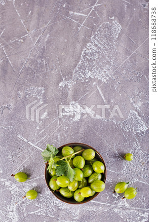 fresh organic gooseberries in a wooden bowl fresh organic gooseberries in a wooden bowl 118688738