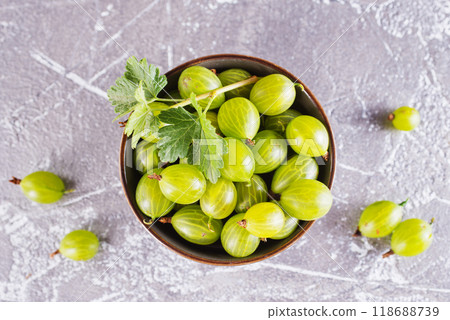 fresh organic gooseberries in a wooden bowl fresh organic gooseberries in a wooden bowl 118688739