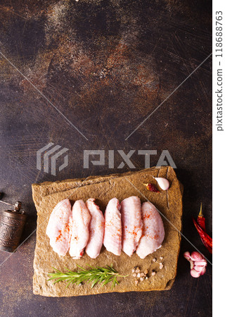 Raw chicken wings with ingredients for cooking Raw chicken wings with ingredients for cooking 118688763
