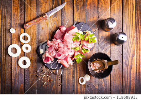 Raw meat shish kebab skewers. Wooden background. 118688915