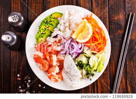 Poke bowl and ingredients on wooden table, 118688928