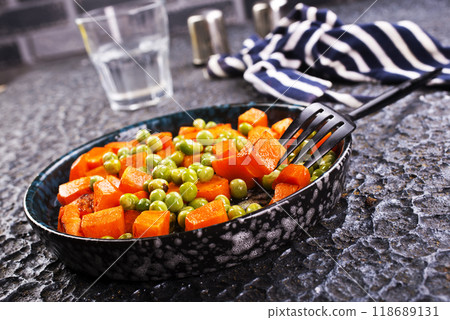 fried pumpkin with green peas in bowl fried pumpkin with green peas in bowl 118689131