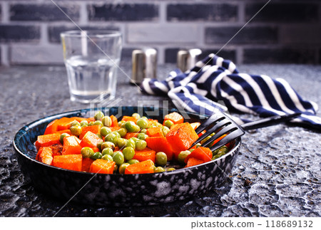 fried pumpkin with green peas in bowl fried pumpkin with green peas in bowl 118689132