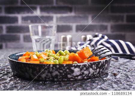 fried pumpkin with green peas in bowl fried pumpkin with green peas in bowl 118689134