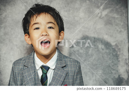 Boy wearing a jacket 118689175