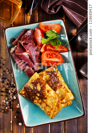 Omelette rolls with ham and cheese. Healthy breakfast. 118689417