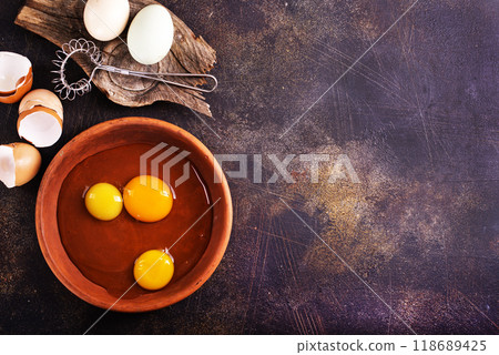 Raw chicken eggs on dark table Raw chicken eggs on dark table 118689425