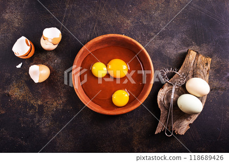 Raw chicken eggs on dark table Raw chicken eggs on dark table 118689426