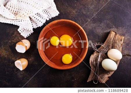 Raw chicken eggs on dark table Raw chicken eggs on dark table 118689428