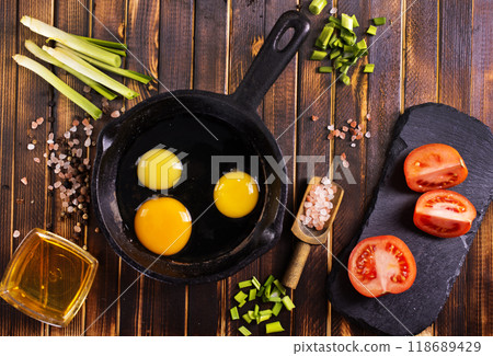 Raw chicken eggs on dark table Raw chicken eggs on dark table 118689429