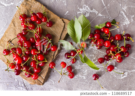 Sweet cherry on stone tray on a table 118689517