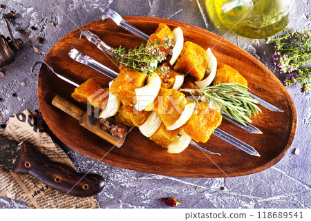 raw kebab with vegetables. On a stone background 118689541