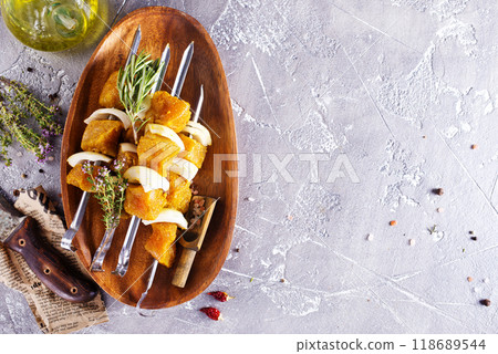 raw kebab with vegetables. On a stone background 118689544