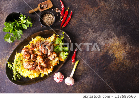 Meat with prunes, goulash and mashed potatoes Meat with prunes, goulash and mashed potatoes 118689560