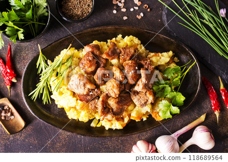 Meat with prunes, goulash and mashed potatoes 118689564