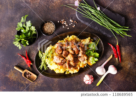 Meat with prunes, goulash and mashed potatoes Meat with prunes, goulash and mashed potatoes 118689565