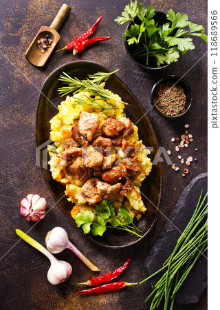 Meat with prunes, goulash and mashed potatoes Meat with prunes, goulash and mashed potatoes 118689566