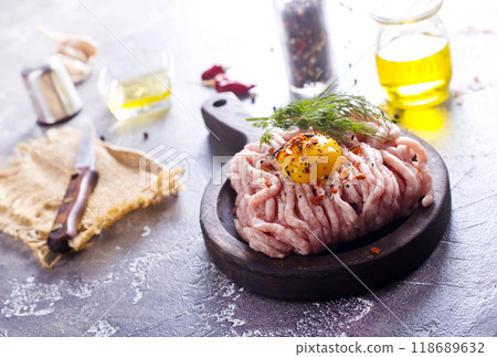 Raw minced chicken fillet, uncooked meat over board Raw minced chicken fillet, uncooked meat over board 118689632