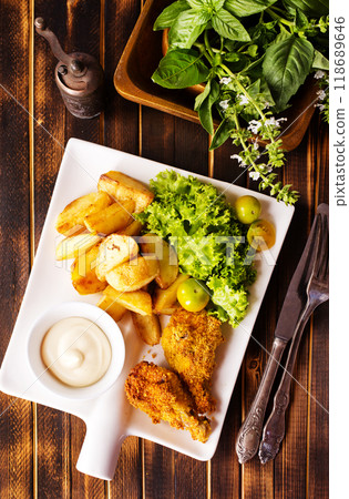 roasted chicken wings with potato 118689646
