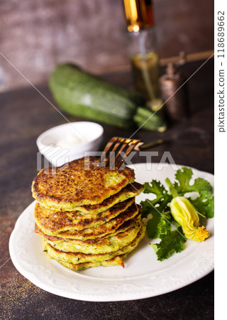 Zucchini Fritters with Herbs and Cream Cheese Topping, Tasty Vegetable Pancakes 118689662