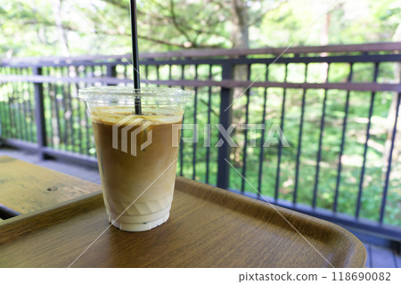 Cafe latte on a cafe table Cafe latte on a cafe table 118690082