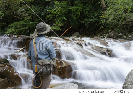 Men fishing in mountain streams 118690502
