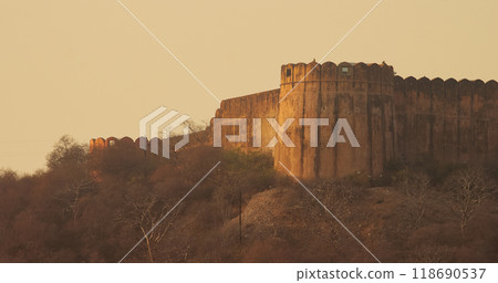 Jaipur, Rajasthan, India. Old Fortress Wall Surrounding Amer Fort Or Amber Fort, Amer In Dusktime. Amer Palace Is Great Example Of Rajput Architecture. Popular Tourist Attraction In Jaipur. Included 118690537