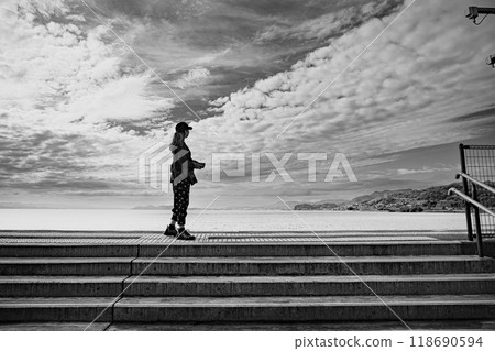 Staring at the sea alone on the platform Staring at the sea alone on the platform 118690594