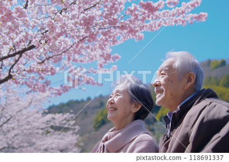 Senior couple looking up cherry blossoms 118691337