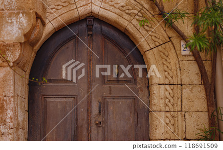 travel to city of Lindos on island of Rhodes, Greece. Details of streets of old town Lindos. Interesting elements of door, shutters, bas-relief of walls. tourist attraction on island of Rhodes 118691509