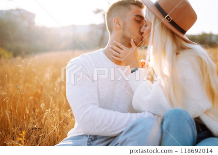 Young couple having fun walking and hugging n the park. Autumn weather. Relaxation, youth. 118692014