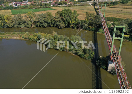 Aerial view of iron bridge over a river 118692292