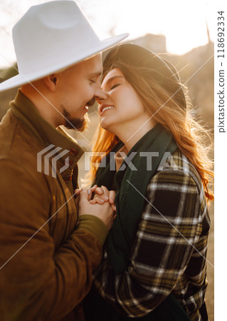 Lovely hipster couple enjoying each other in the autumn park. Nice autumn day. love and lifestyle. Lovely hipster couple enjoying each other in the autumn park. Nice autumn day. love and lifestyle. 118692334